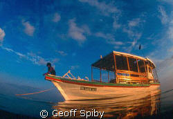 returning to our diving dhoni at the end of a late aftern... by Geoff Spiby 